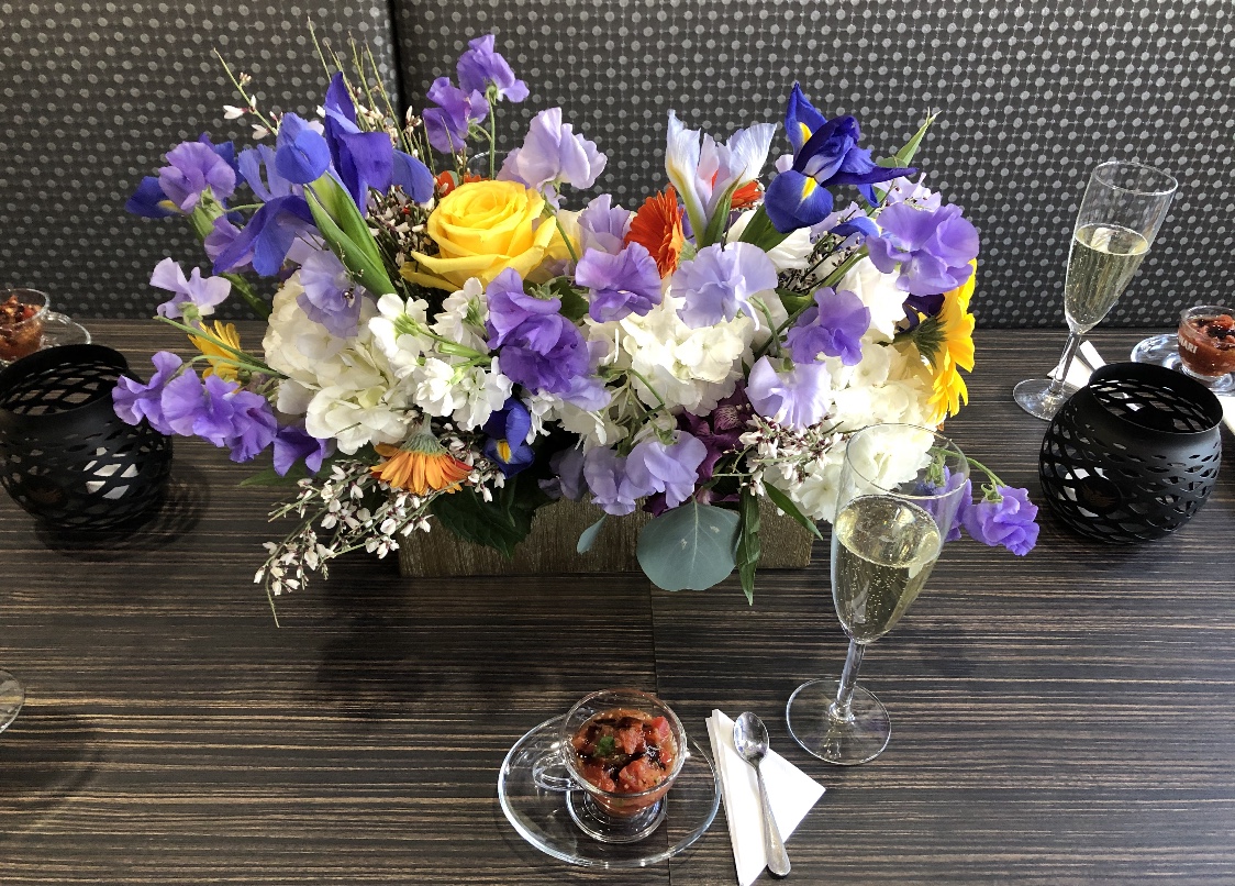 a bouquet of flowers in a vase on a table